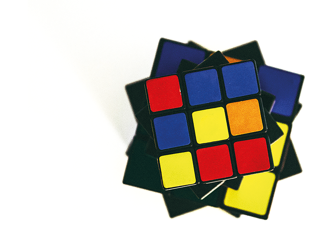 Ein sogenannter Zauberwürfel (Rubik’s Cube) aufgefächert und verdreht, sodass auf der Fläche vorne unterschiedliche Farben zu sehen sind